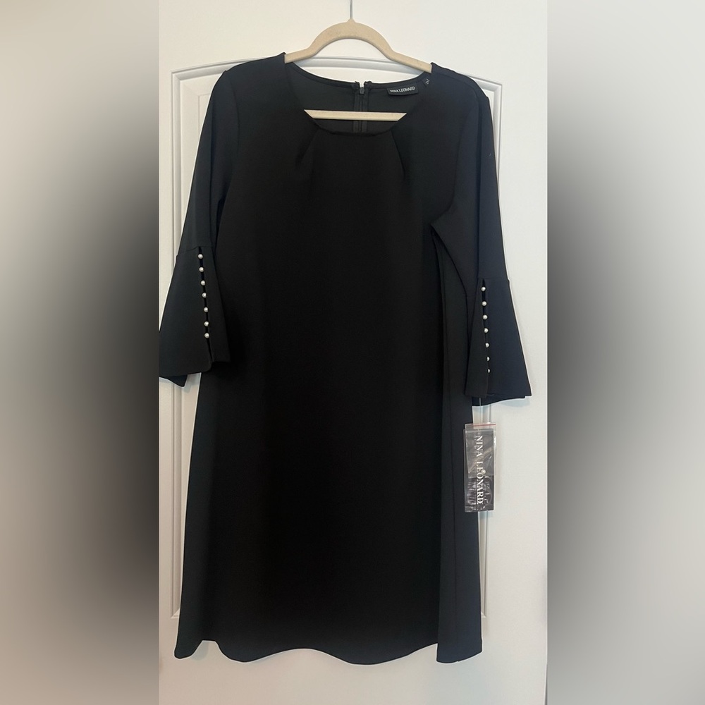 Little black dress brand new with pearl accent sleeves
